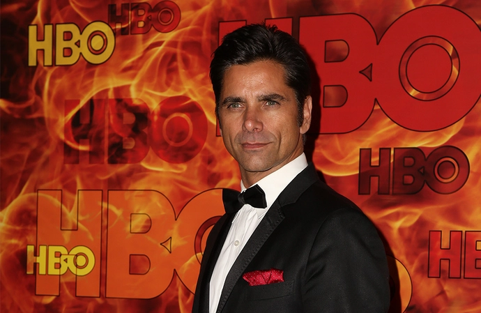 John Stamos opened up about his marriage to Rebecca Romijn
