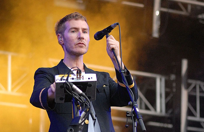 Massive Attack's concert has prompted a probe for the display of the Palestinian flag