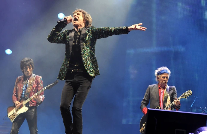 Sir Mick Jagger on stage at Glastonbury in 2013
