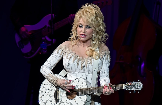 Dolly Parton is hoping Elton John will jump on her cover