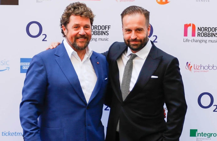 Michael Ball and Alfie Boe share a clap before going on stage