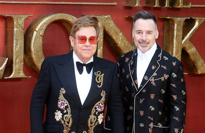 Elton had backstage cardboard cut-outs made of his husband and sons