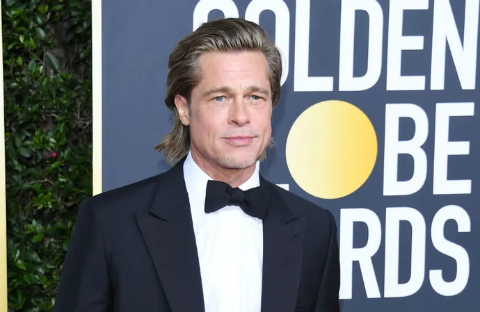 Brad Pitt says he asked for the makers of ‘Babylon’ to write in his screen kiss with co-star Margot Robbie