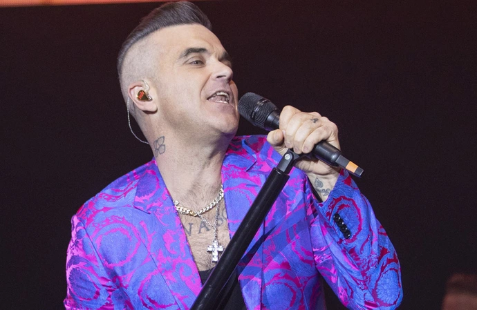 Robbie Williams admits he's "never been truly happy" with anything he's made