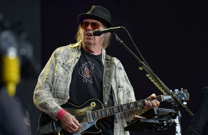 Neil Young will be performing at Glastonbury after all