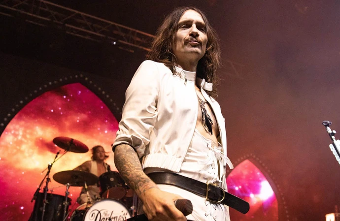 Justin Hawkins' stage jumping has left him injured