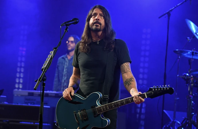 Dave Grohl struggled to hold back the tears as he honoured Taylor Hawkins
