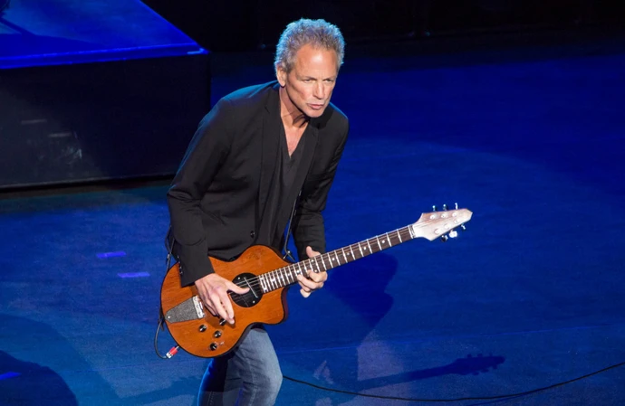 Lindsey Buckingham was attacked by a woman outside a building