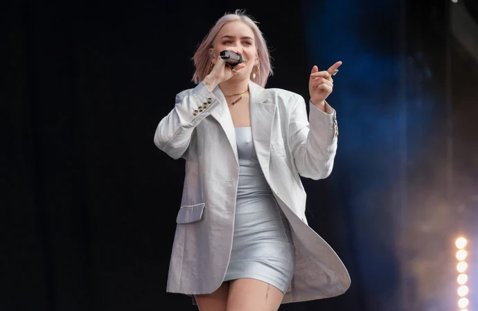 Anne-Marie calms pre-stage nerves by doing her own glam