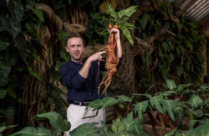 Tom Felton unveils Professor Sprout’s greenhouse, part of the new Mandrakes and Magical Creatures feature opening at Warner Bros. Studio Tour London 1st July