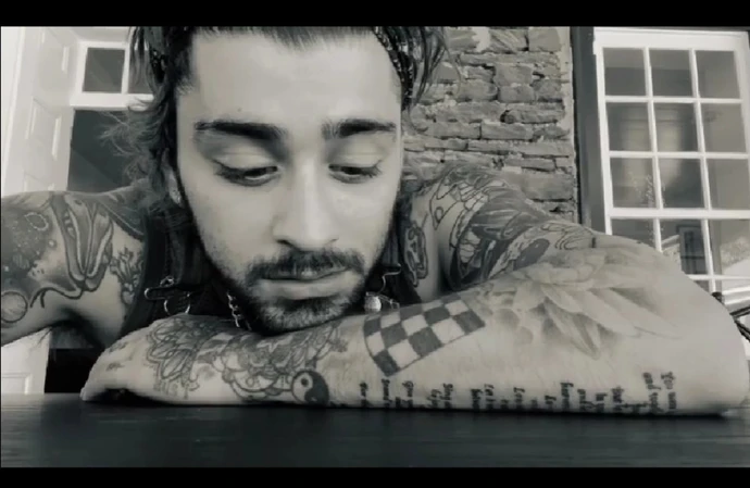 Zayn Malik appeared reflective as he performed the One Direction song
