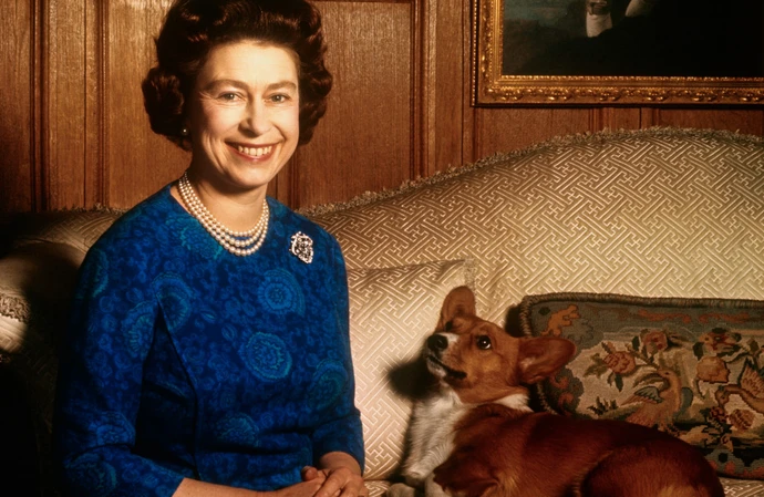 Queen Elizabeth with one of beloved pet dogs at Sandringham House in 1970