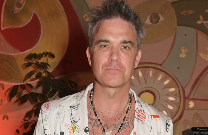 Robbie Williams' dad is recovering after his fall