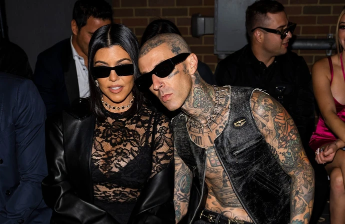 Travis Barker and his pregnant wife Kourtney Kardashian have been seen leaving a hospital after he and his band postponed their tour for an ‘urgent family matter’