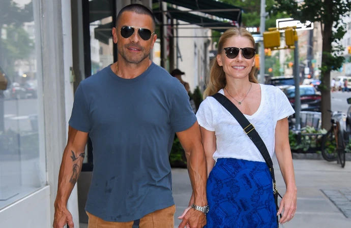 Kelly Ripa says her husband will be her television co-host ‘until one of us dies‘