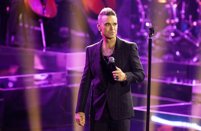 Robbie Williams has reportedly put his business plans on hold due to a trademark issue