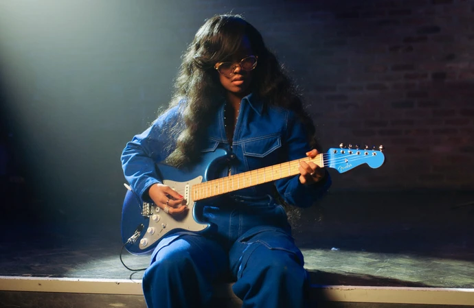 H.E.R. pays tribute to her musician father Kenny Wilson with her limited edition Fender Strat