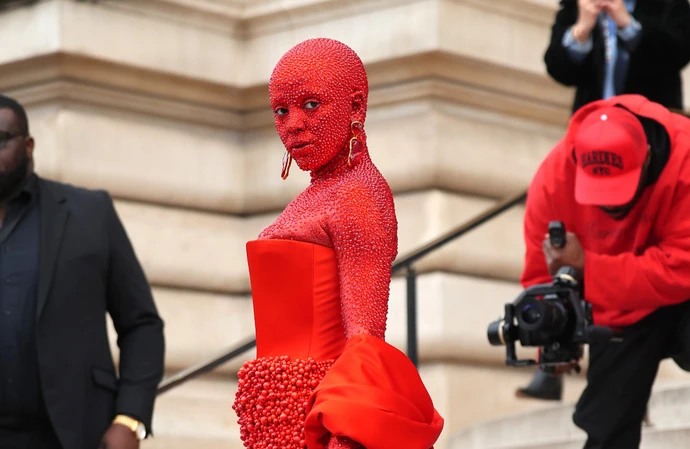 Doja Cat was battling stomach flu on the day she turned heads at Paris Fashion Week in an all-red outfit