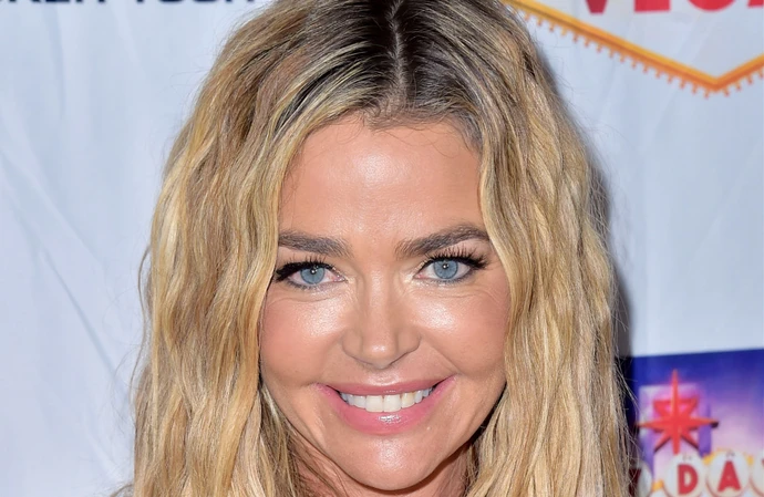 Denise Richards is feeling 'healthy and confident' after undergoing breast implant revision surgery