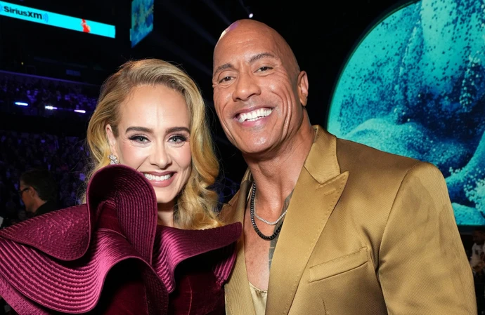 Adele and Dwayne Johnson at the Grammy Awards