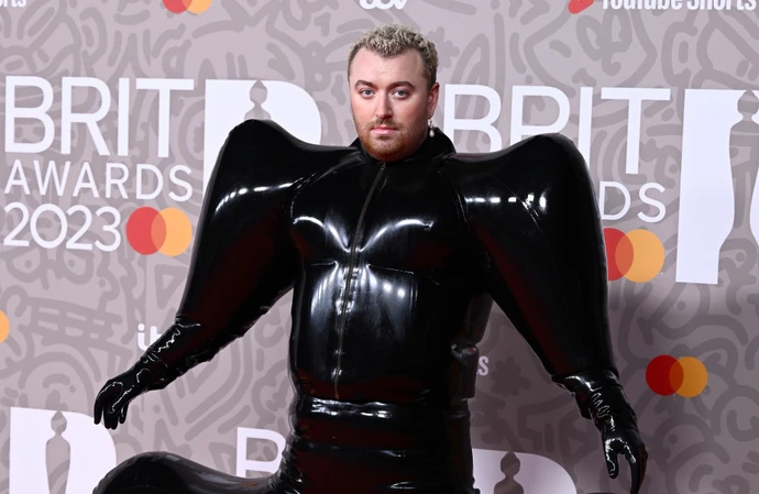 Sam Smith has left fans wondering how they are going to use the toilet at The BRIT Awards 2023 after they turned up for the ceremony in a huge black inflatable bodysuit