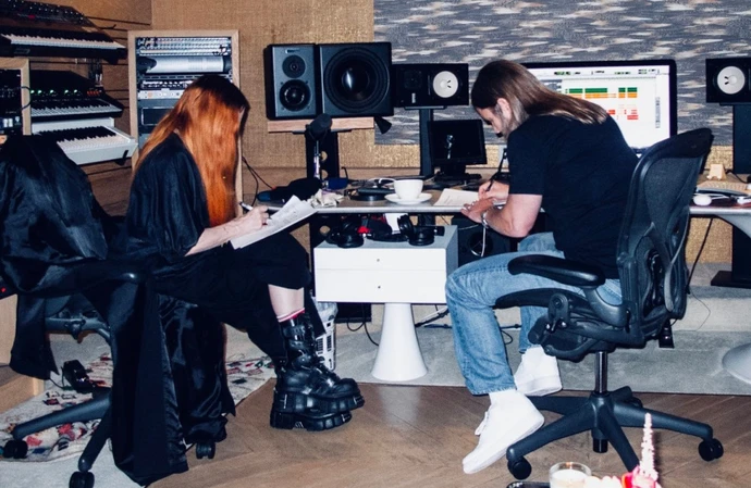 Madonna and Max Martin can be seen hard at work in the studio