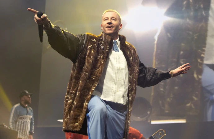 Macklemore is facing a backlash for his 'Free Palestine' protest at Ed Sheeran's concert