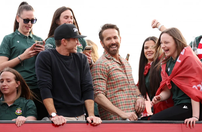 Ryan Reynolds and Rob McElhenney celebrated Wrexham's promotion on a victory parade through the town