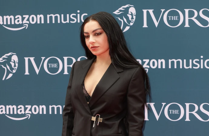 Charli XCX says her 1975 drummer and lyricist boyfriend has influenced her to 'take some time' when creating new music
