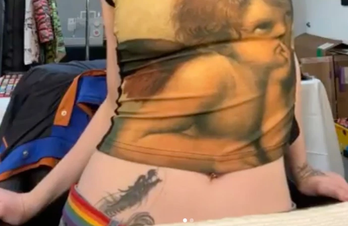 Billie Eilish has given fans a glimpse of her huge dragon tattoo after once saying fans would ‘never’ see her body art