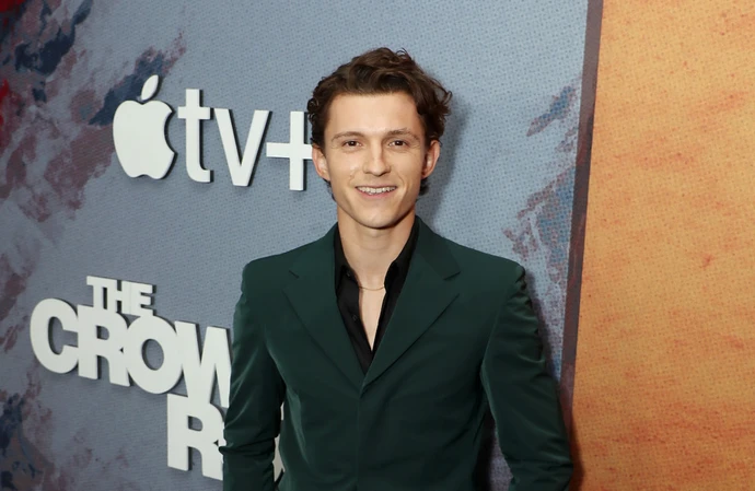Tom Holland jokes about his Spider-Man role to his friends