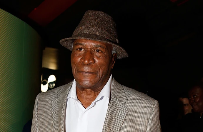 John Amos insists he's doing well