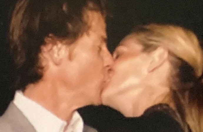 Julia Roberts has marked her 21st wedding anniversary with a rare snap of her kissing husband Danny Moder