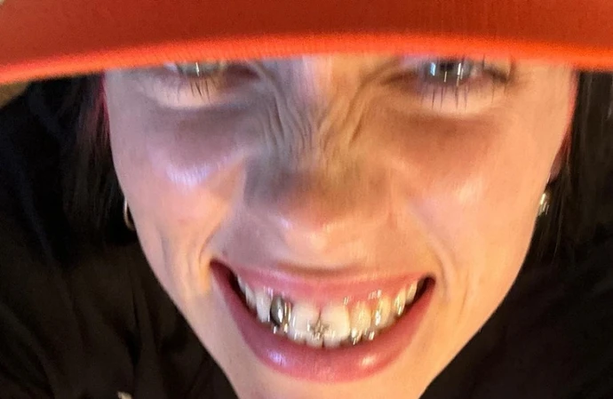 Billie Eilish has stunned fans by showing off diamond grills on her teeth