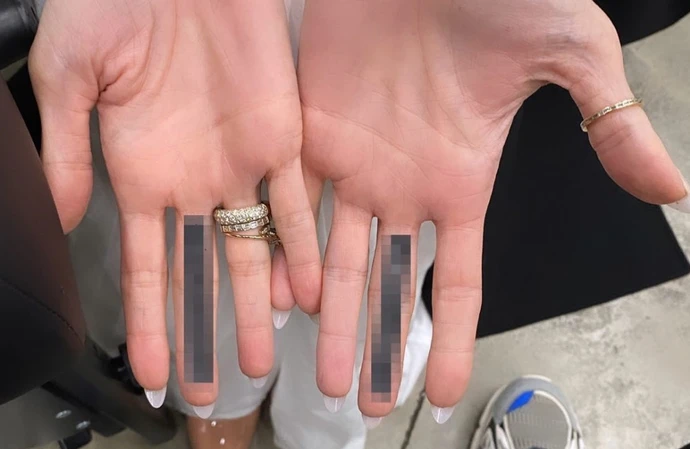 Angelina Jolie has had mystery tattoos on both her middle fingers – prompting fans to speculate it is a ‘f*** you’ to her ex Brad Pitt