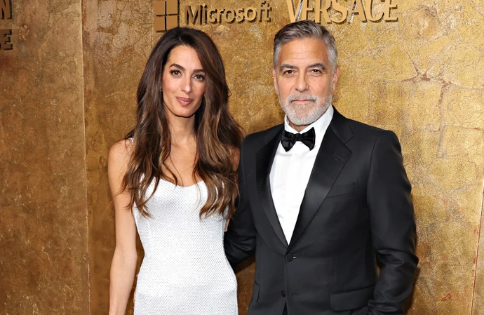 George and Amal Clooney refuse to explain fame to their kids