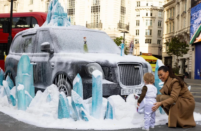 Jess Wright with son Presley checking out Frozen display in London