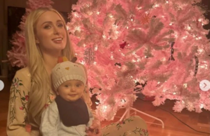 Paris Hilton is learning how to juggle work with being a mum