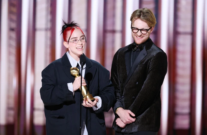 Billie Eilish and Finneas O'Connell accept their Golden Globe Award