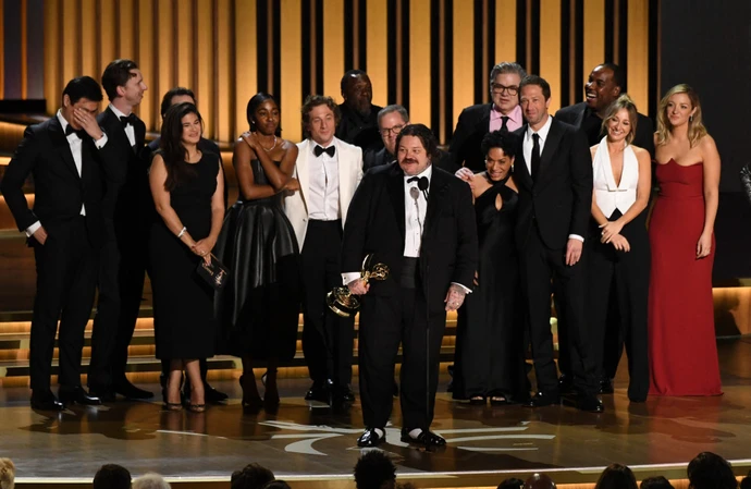 The Bear cast and crew accepting their Emmy Award