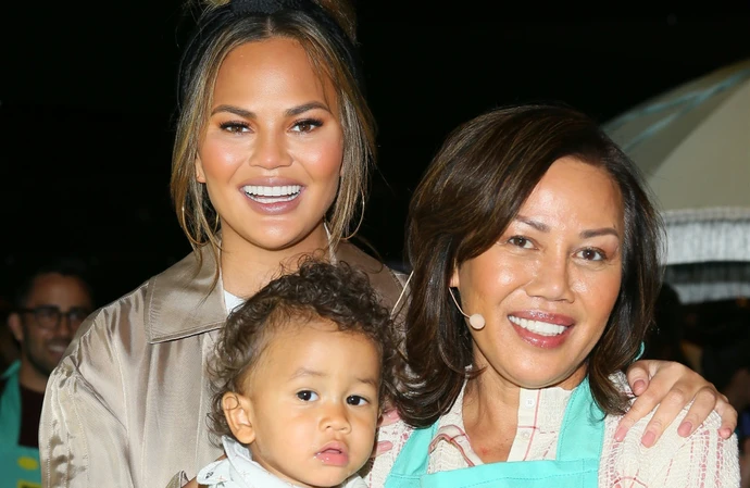 Chrissy Teigen is finding it 'weird' not having her mom there