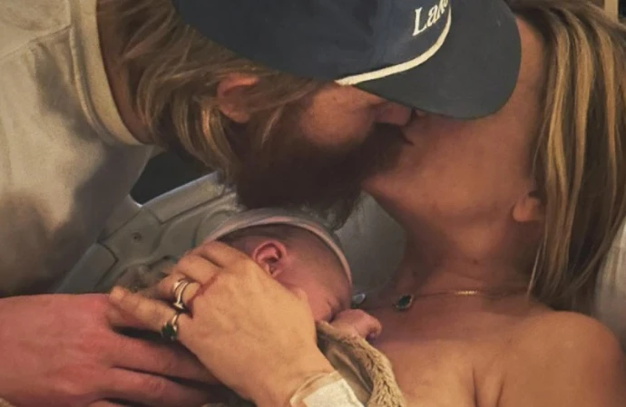 Wyatt Russell and Meredith Hagner with their new baby (c) Instagram