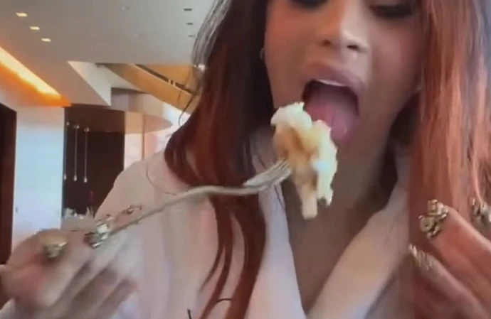 Cardi B has mocked body-shaming trolls by videoing herself gorging on a plate of pancakes