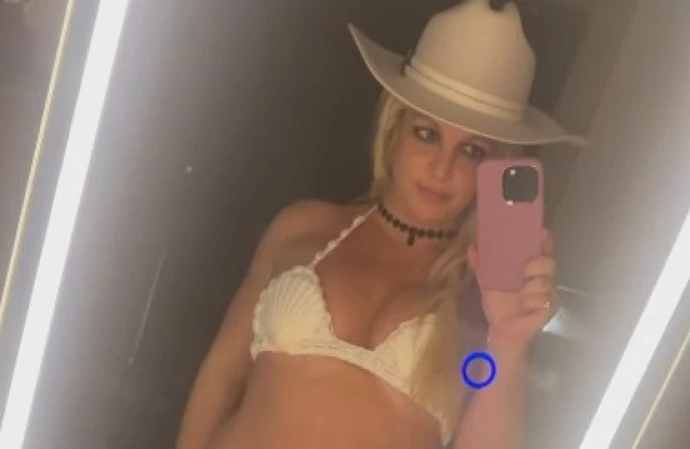 Britney Spears says she has lost two inches off her waist