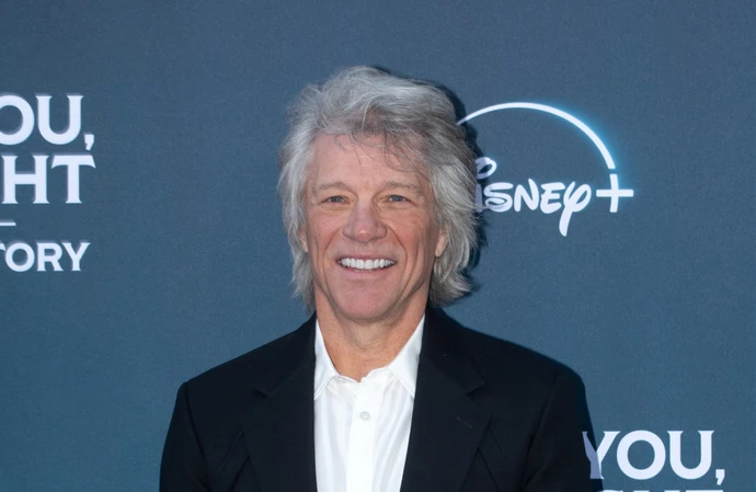 Jon Bon Jovi helps woman down from ledge