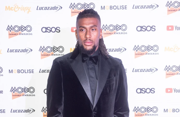 Alex Iwobi starts his day with an outfit for looking after his dogs