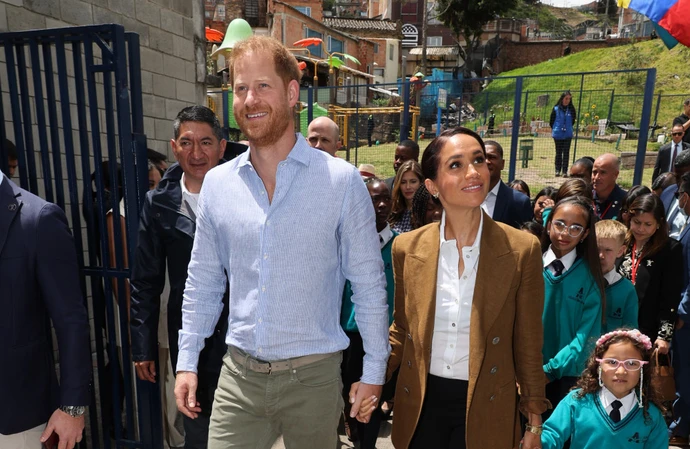 Prince Harry and Meghan, Duchess of Sussex are being protected on their Colombia tour by an officer wielding a Kevlar shield known as a ‘ballistic briefcase’ to stop a shooter targeting the couple