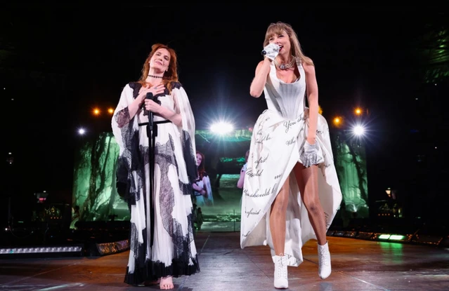 Taylor Swift performs with Florence Welch at London's Wembley Stadium