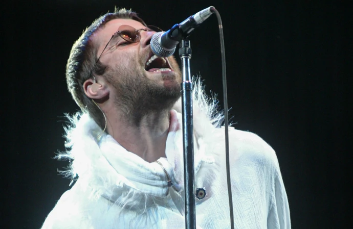 Liam Gallagher performing with Oasis at the 2004 Glastonbury Festival