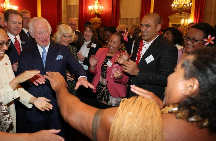 King Charles dances with Freddie Tuilagi